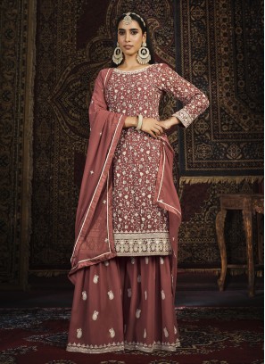 Attractive Embroidered Rust Faux Georgette Salwar Kameez