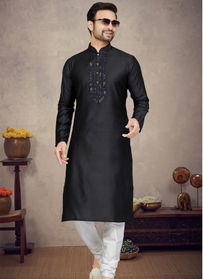 Black Jaquard Kurta with Off White Churidar Bottoms.