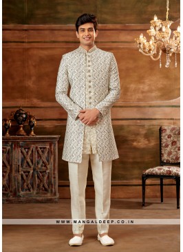 Cream & Blue Navabi Indo Western Embroidered Art Banarasi Silk Sherwani with Art Silk Aligadhi Bottom.