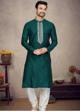 Green Jaquard Kurta with Cream Churidar Bottoms.