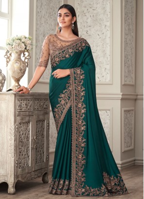 Impeccable Silk Teal Embroidered Traditional Saree