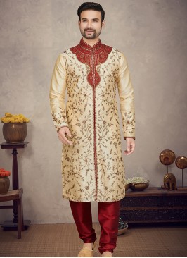 Gold Art silk Kurta with Marron Churidar Bottoms.