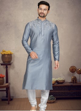 Grey Jaquard Kurta with Off White Churidar Bottoms.