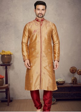 Chikoo Art silk Kurta with Marron Churidar Bottoms.