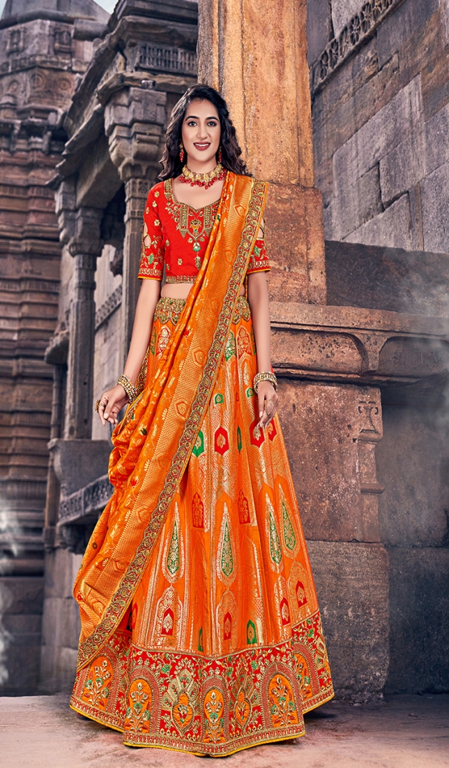 Unique Orange-Pink Colored Designer Embroidered Wedding Wear Tapeta-Raw  Silk Lehenga Saree