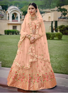 Peach Ceremonial Net A Line Lehenga Choli