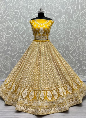 Yellow Elegance Latest Designer Party Wear Heavy Soft Net Lehenga Choli.