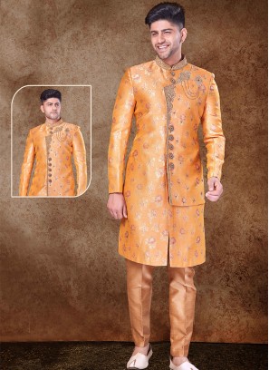 Regal Orange and Chikoo Sherwani with Jaqard Top and Dhupion Silk Bottom.