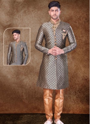 Regal Bottle Green and Chikoo Sherwani with Jaqard Top and Dhupion Silk Bottom.