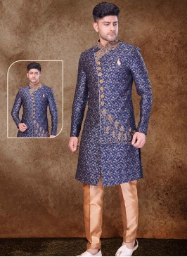 Regal Blue and Chikoo Sherwani with Jaqard Top and Dhupion Silk Bottom.