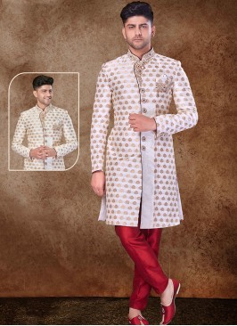 Regal Off White and Maroon Sherwani with Jaqard Top and Dhupion Silk Bottom.