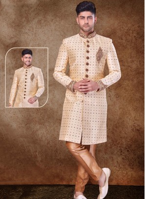 Regal Gold and Chikoo Sherwani with Jaqard Top and Dhupion Silk Bottom.