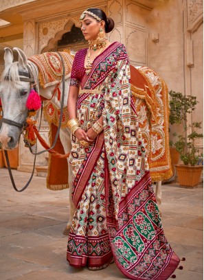 Riveting Patola Print Silk Cream Classic Saree