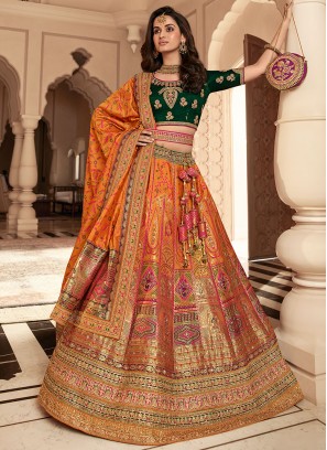 Strange Weaving Green and Orange Banarasi Silk Designer Lehenga Choli