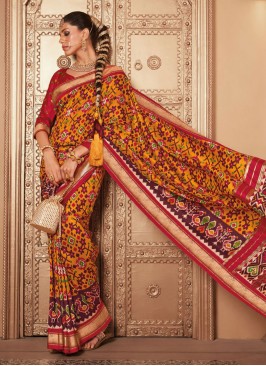 Surpassing Mustard Patola Print Traditional Saree