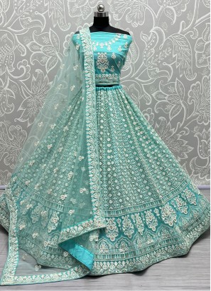 Turquoise Elegance Latest Designer Party Wear Heavy Soft Net Lehenga Choli.